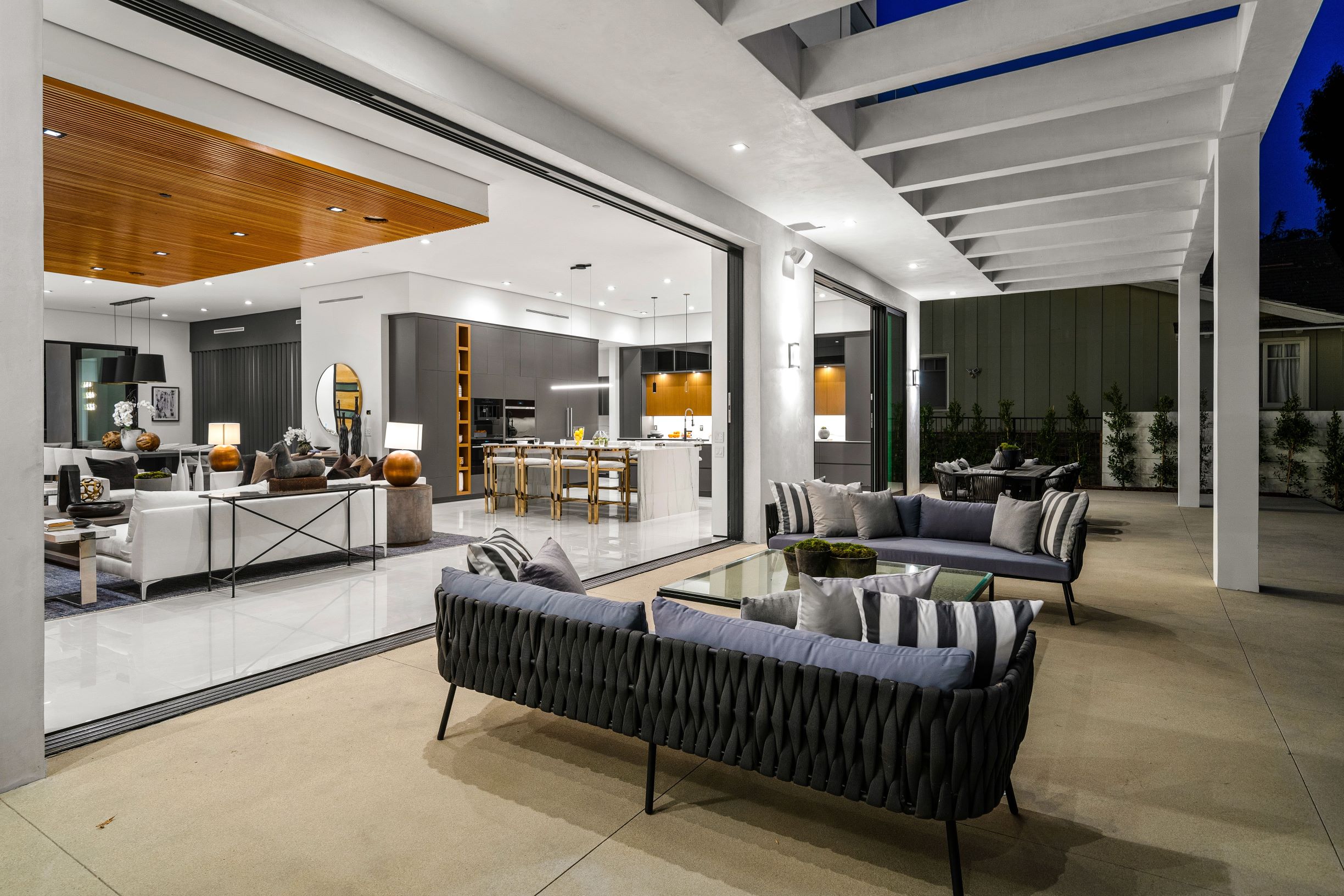 Patio with open multi-sliding aluminum doors.