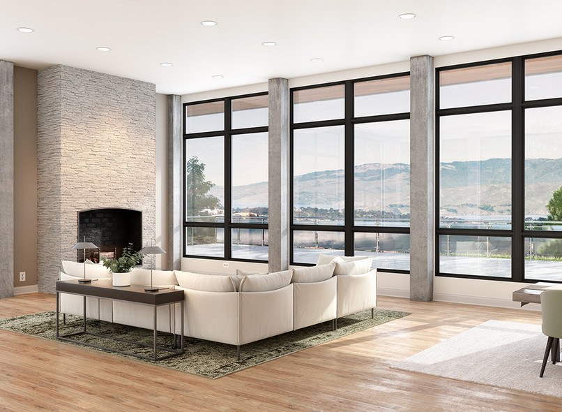 A large modern living room with three sets of double fixed Milgard Ultra C650 windows. The windows are split with black rails down the middle and toward the top and bottom. 