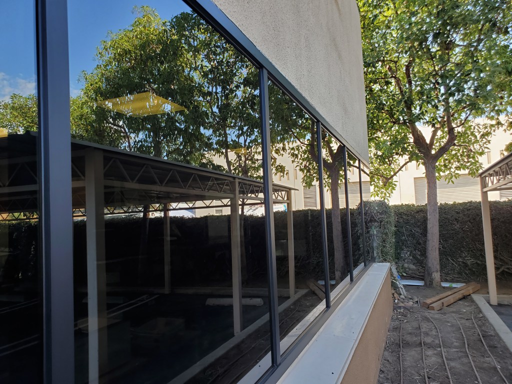 Commercial dark tinted office windows with black aluminum frame