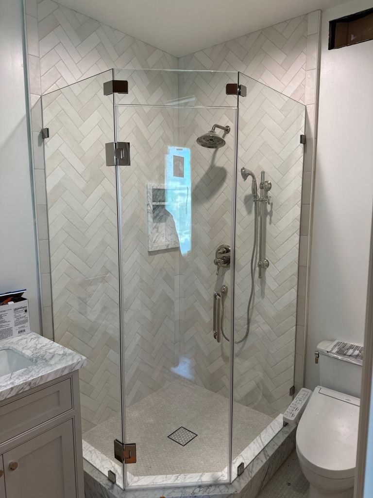 Frameless glass shower with diagonal door