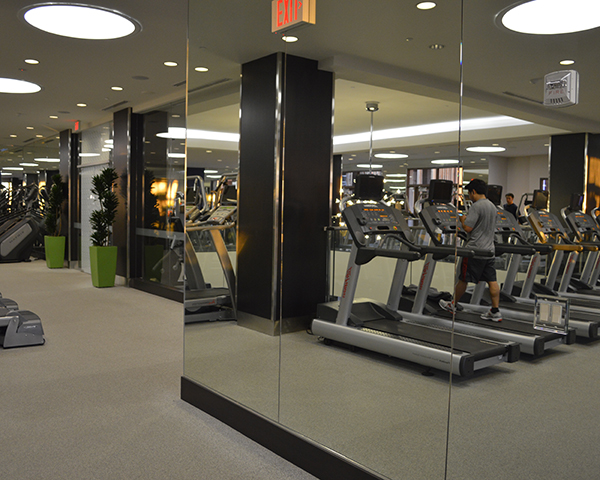Gym wall made of mirror panels. 