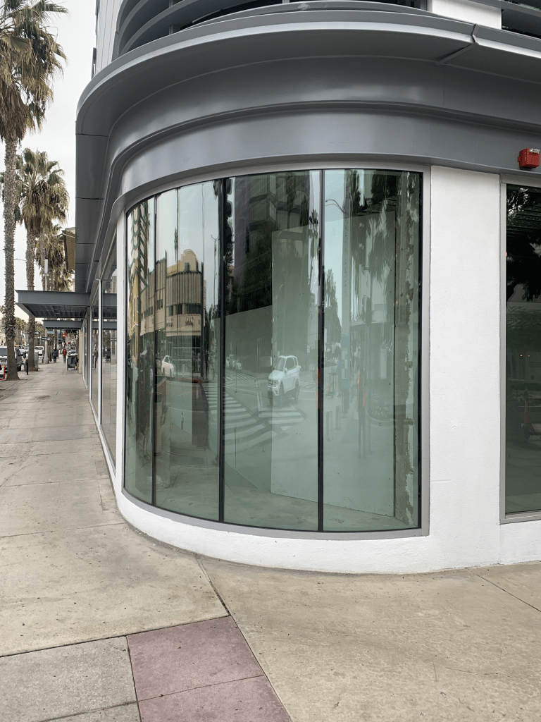 Curved storefront corner glass